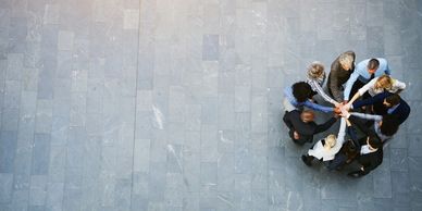 Top-shot of executives huddling